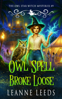 Book cover for Owl Spell Broke Loose by Leanne Leeds. A red-haired witch named Astra in a black hat and denim shorts stands beside Archie, a Great Horned Owl perched on a mossy stump, as blue-green magical lightning crackles from her fingertips at a tropical night festival.