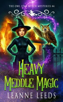Book cover for 'Heavy Meddle Magic' by Leanne Leeds. An illustrated woman with dark hair stands in front of a spooky, glowing purple house at night, accompanied by a small brown owl, with pumpkins and a Halloween theme.